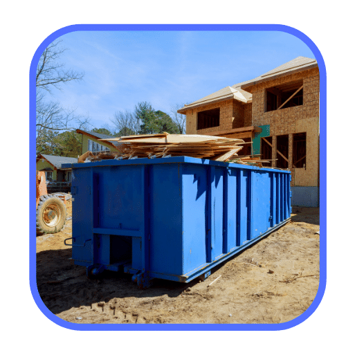 blue dumpster for rent at construction site